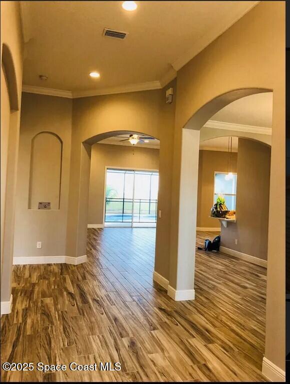 2855 Trasona Drive Melbourne, FL 32940 - Photo 2 of 5 a view of a room with wooden floor and furniture