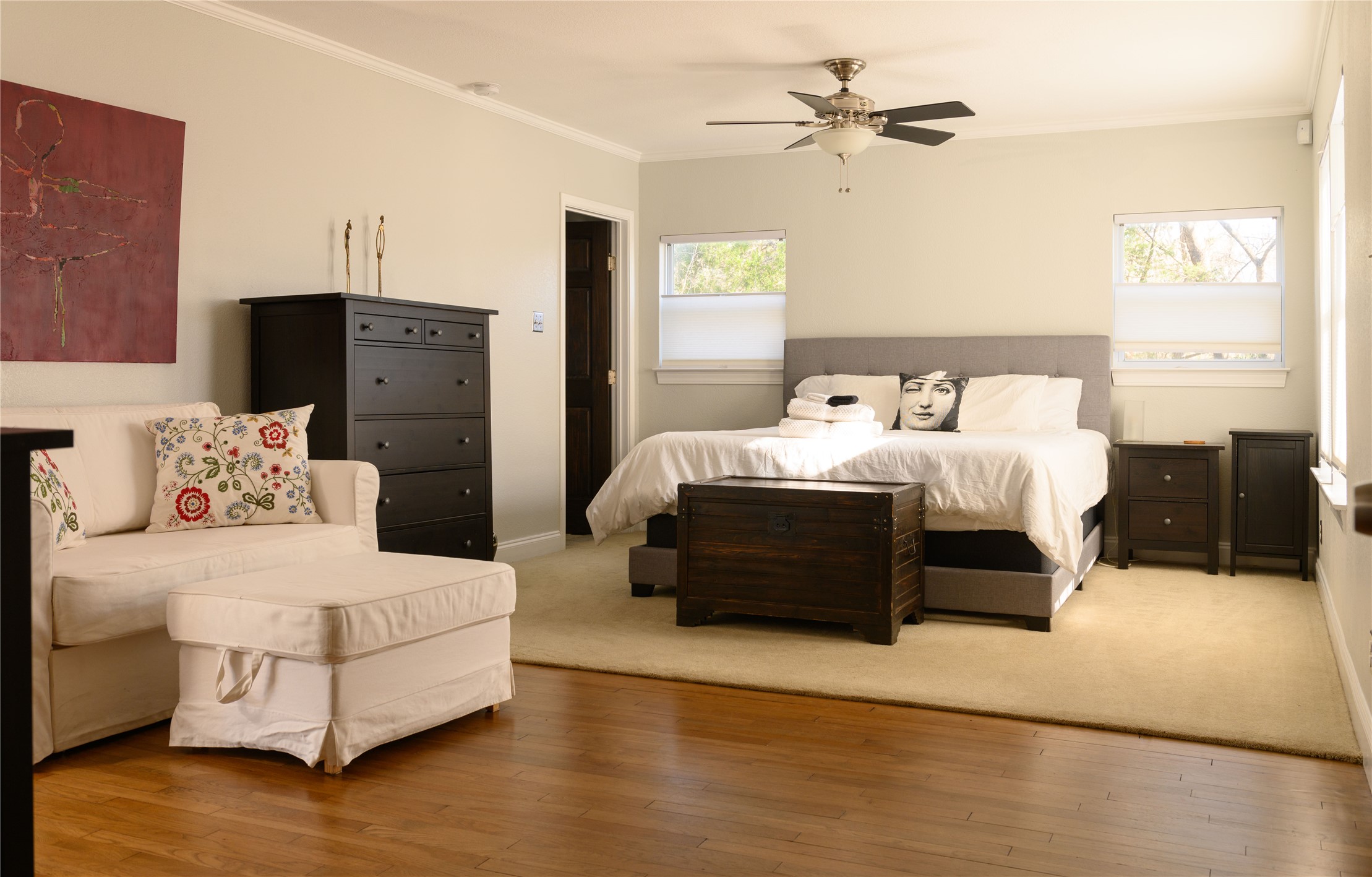 4902 Pecan Springs Road Austin, TX 78723 - Photo 30 of 40 a bedroom with bed and a chandelier