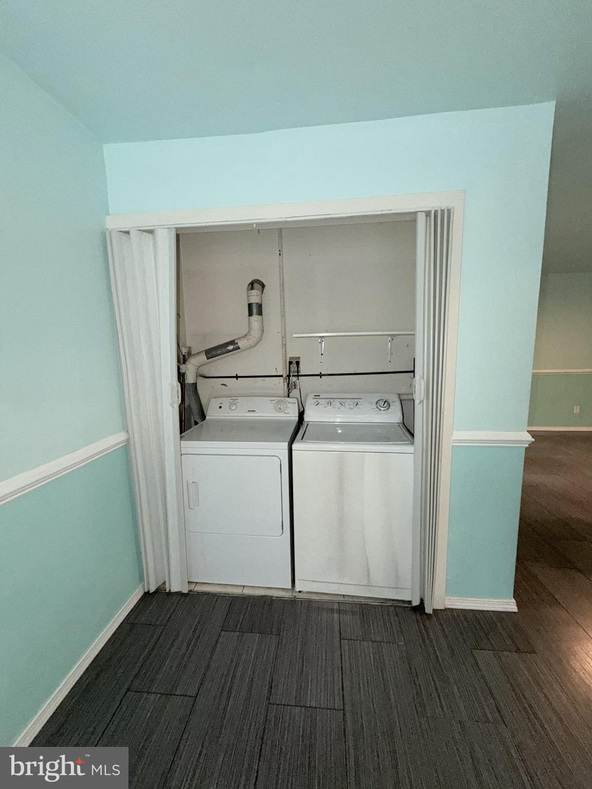 11206 Cherry Hill Road, Unit 92 Beltsville, MD 20705 - Photo 16 of 18 a utility room with cabinets and washer