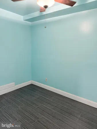 a view of a small space with wooden floor