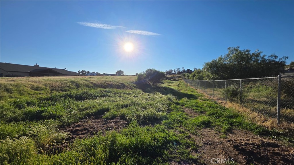 25325 Waldon Road Menifee, CA 92584 - Photo 4 of 8 a view of a lush green field