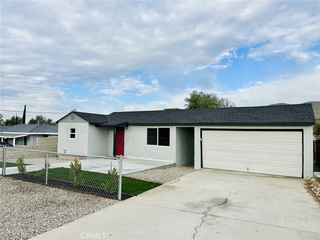 a front view of a house with garage