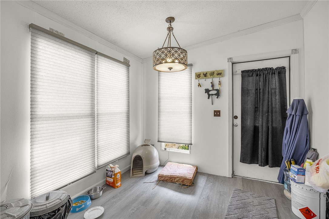 1549 Bethany Church Road Belton, SC 29627 - Photo 25 of 36 A well-lit utility space features durable flooring and functional blinds, offering practical living solutions.
