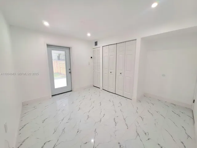 a bathroom with a toilet a sink and shower