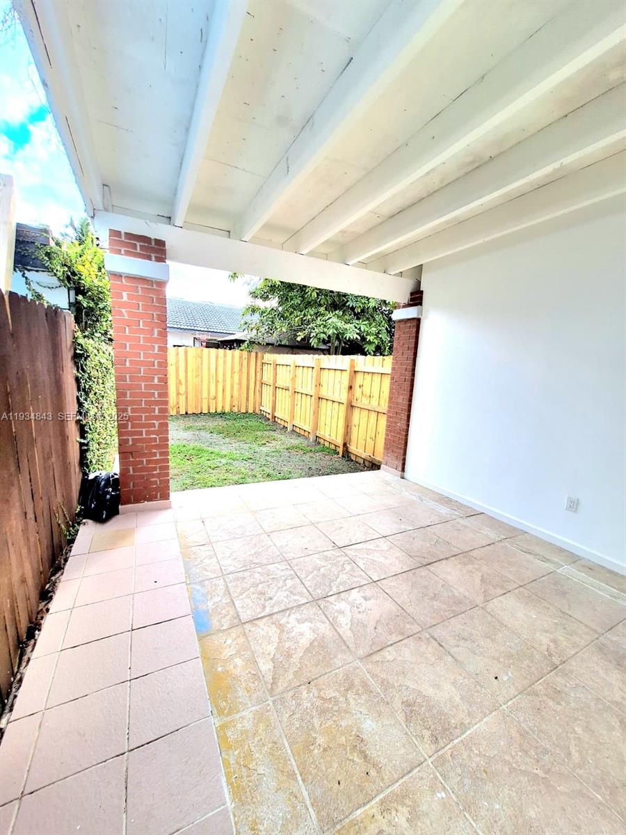 14402 Southwest 111th Street, Unit 14402 Miami, FL 33186 - Photo 20 of 21 a view of porch with seating space