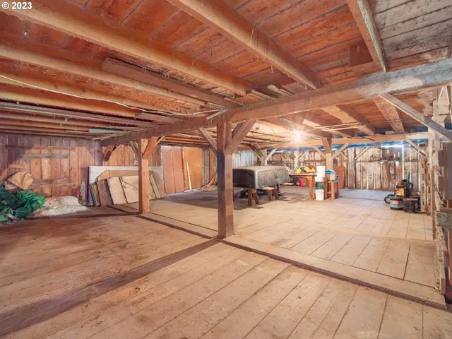 a view of a garage with wooden floors