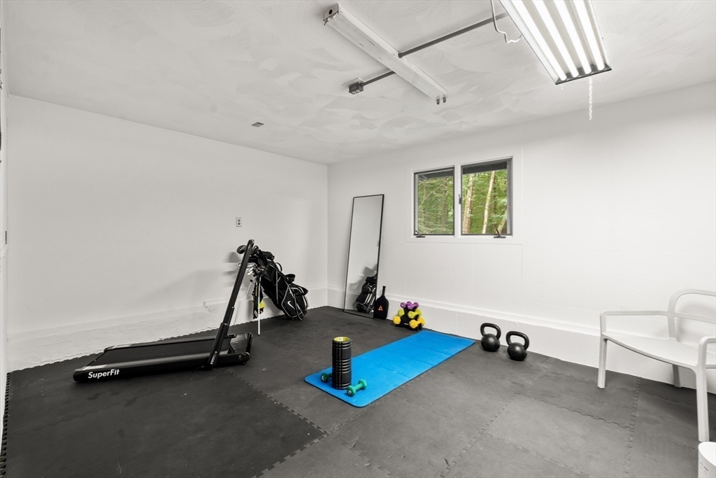 43 Willowdale Road Topsfield, MA 01983 - Photo 24 of 34 a room with gym equipment and windows