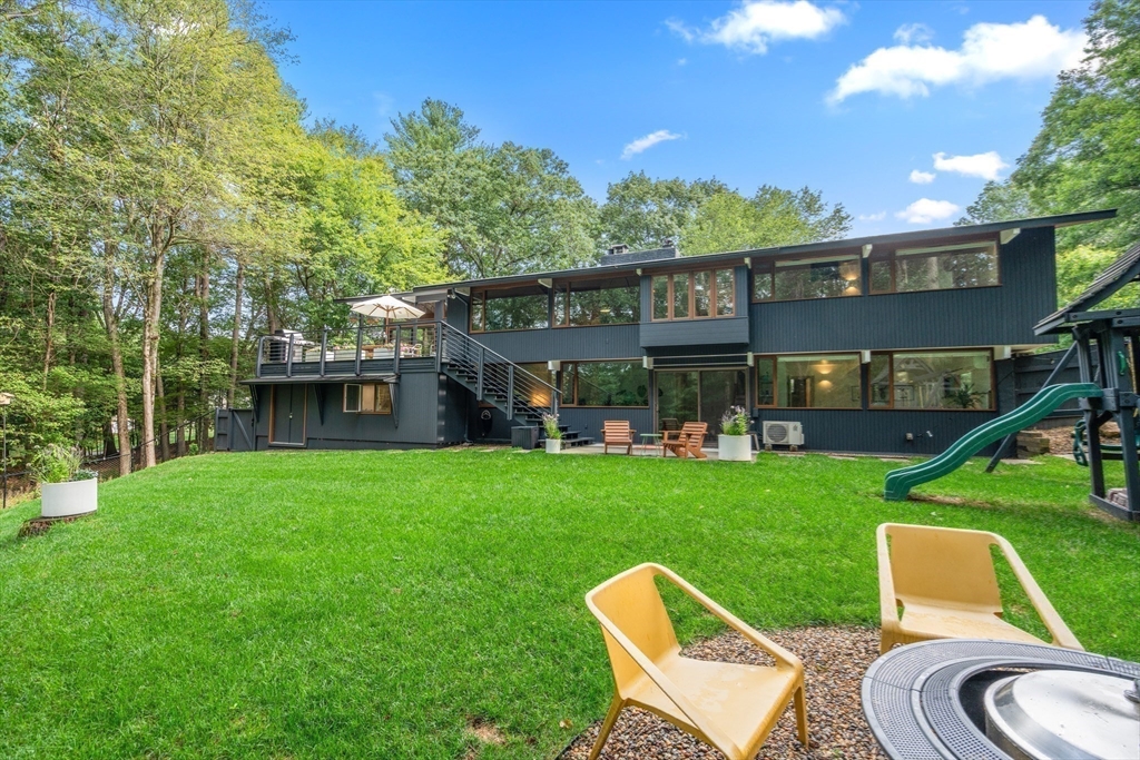 43 Willowdale Road Topsfield, MA 01983 - Photo 28 of 34 a view of a house with a yard porch and sitting area