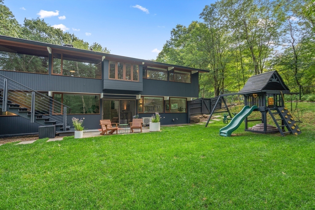43 Willowdale Road Topsfield, MA 01983 - Photo 30 of 34 a view of a house with a yard and sitting area