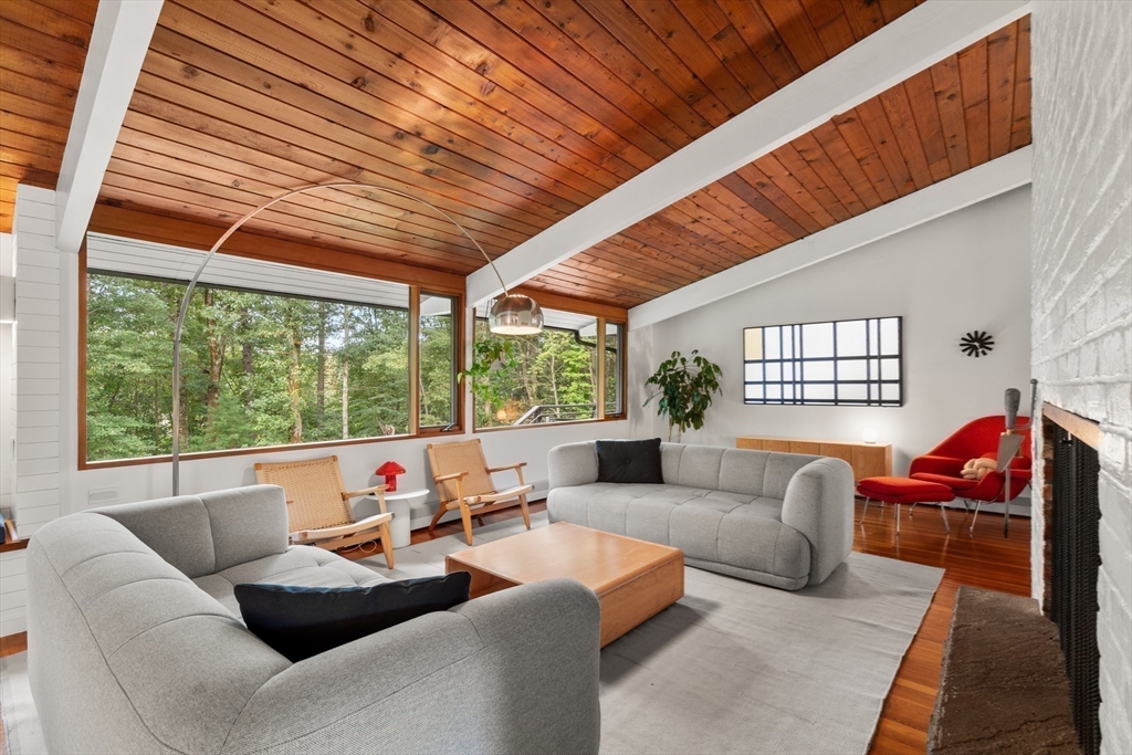 43 Willowdale Road Topsfield, MA 01983 - Photo 6 of 34 a living room with furniture a fireplace and a large window