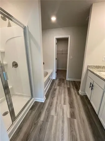 a view of a bathroom from a hallway