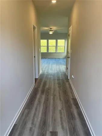 a view of wooden floor in an empty room