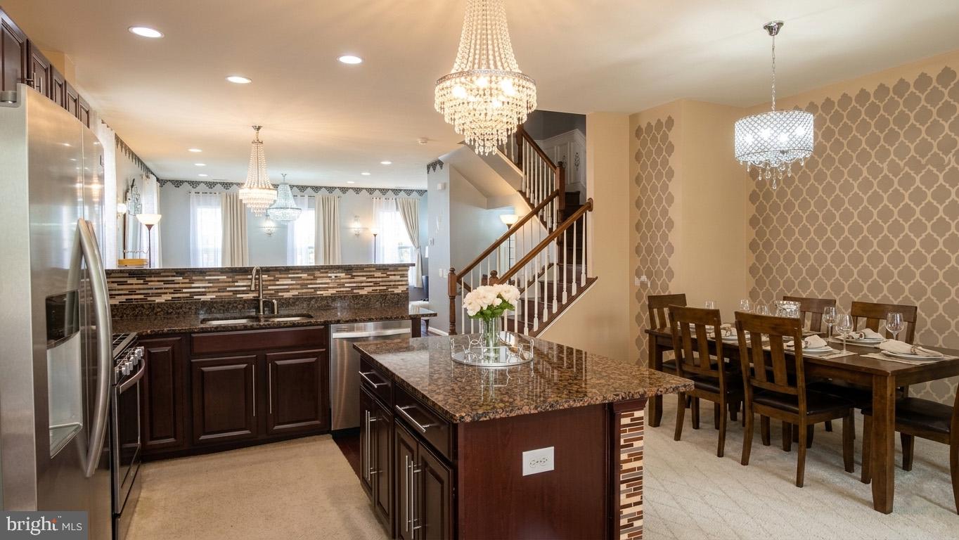 17143 Gibson Mill Road Dumfries, VA 22026 - Photo 2 of 35 Elegant kitchen with dining area charm.