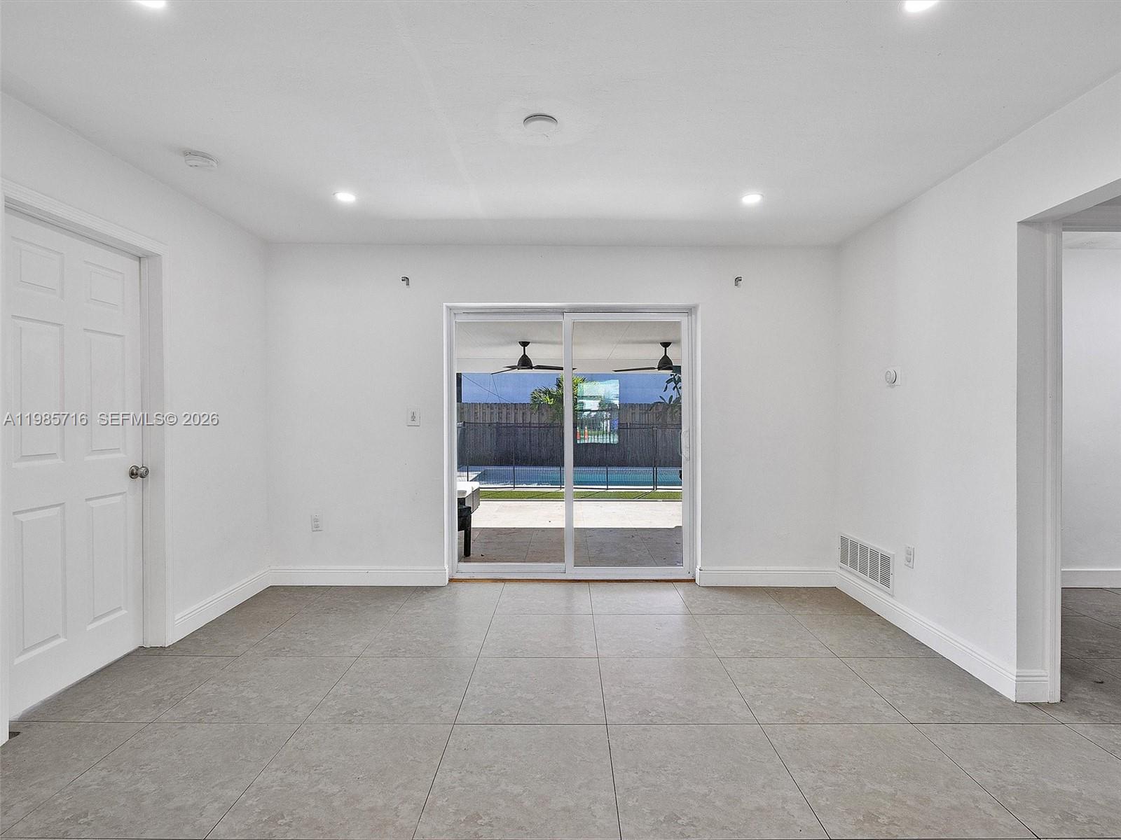 340 Northwest 45th Street Miami, FL 33127 - Photo 12 of 25 a view of an empty room with a window