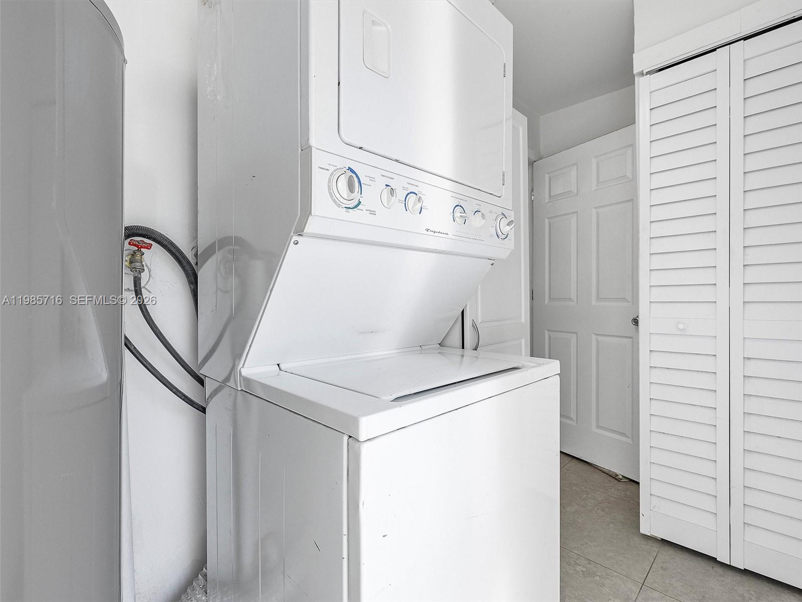 340 Northwest 45th Street Miami, FL 33127 - Photo 24 of 25 a utility room with dryer and washer