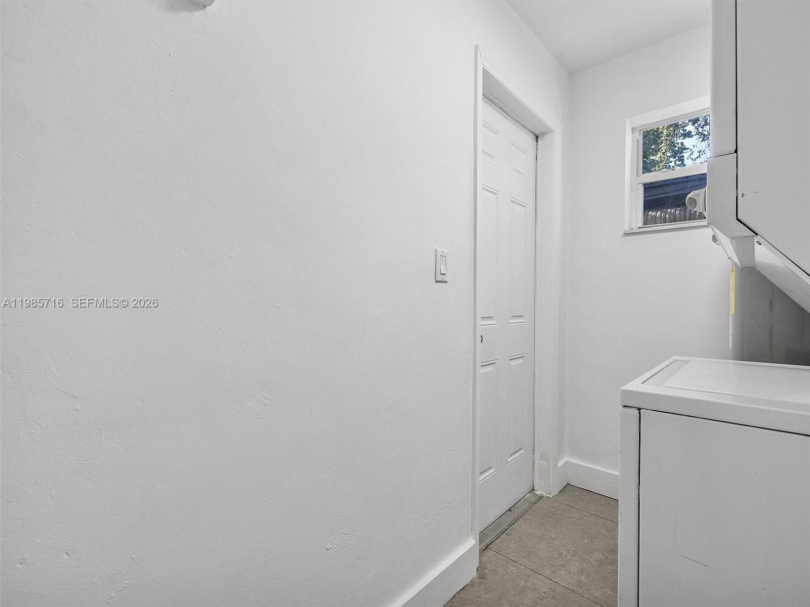340 Northwest 45th Street Miami, FL 33127 - Photo 25 of 25 a view of a storage & utility room with a washer dryer