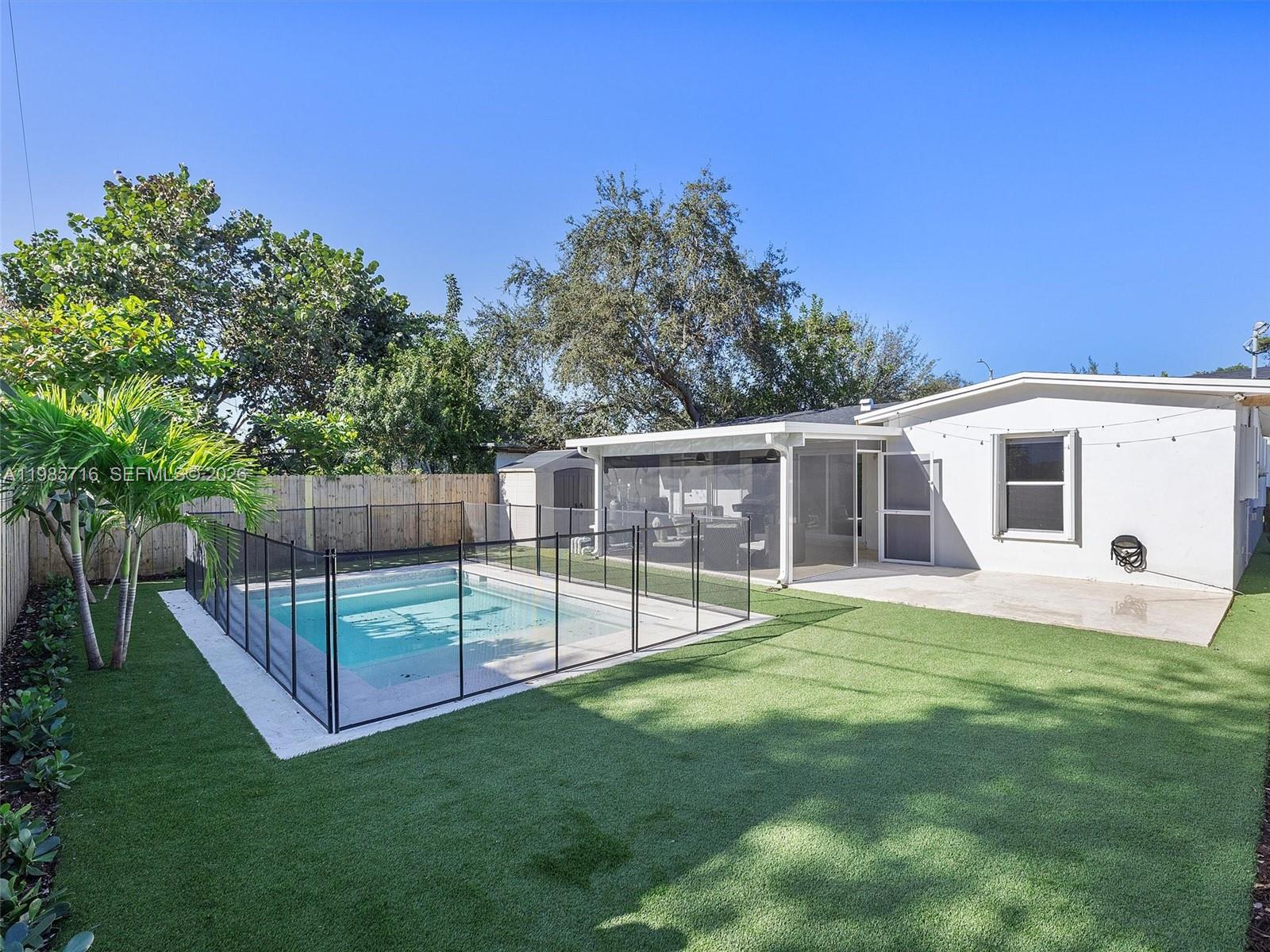 340 Northwest 45th Street Miami, FL 33127 - Photo 5 of 25 a view of a backyard with a small cabin