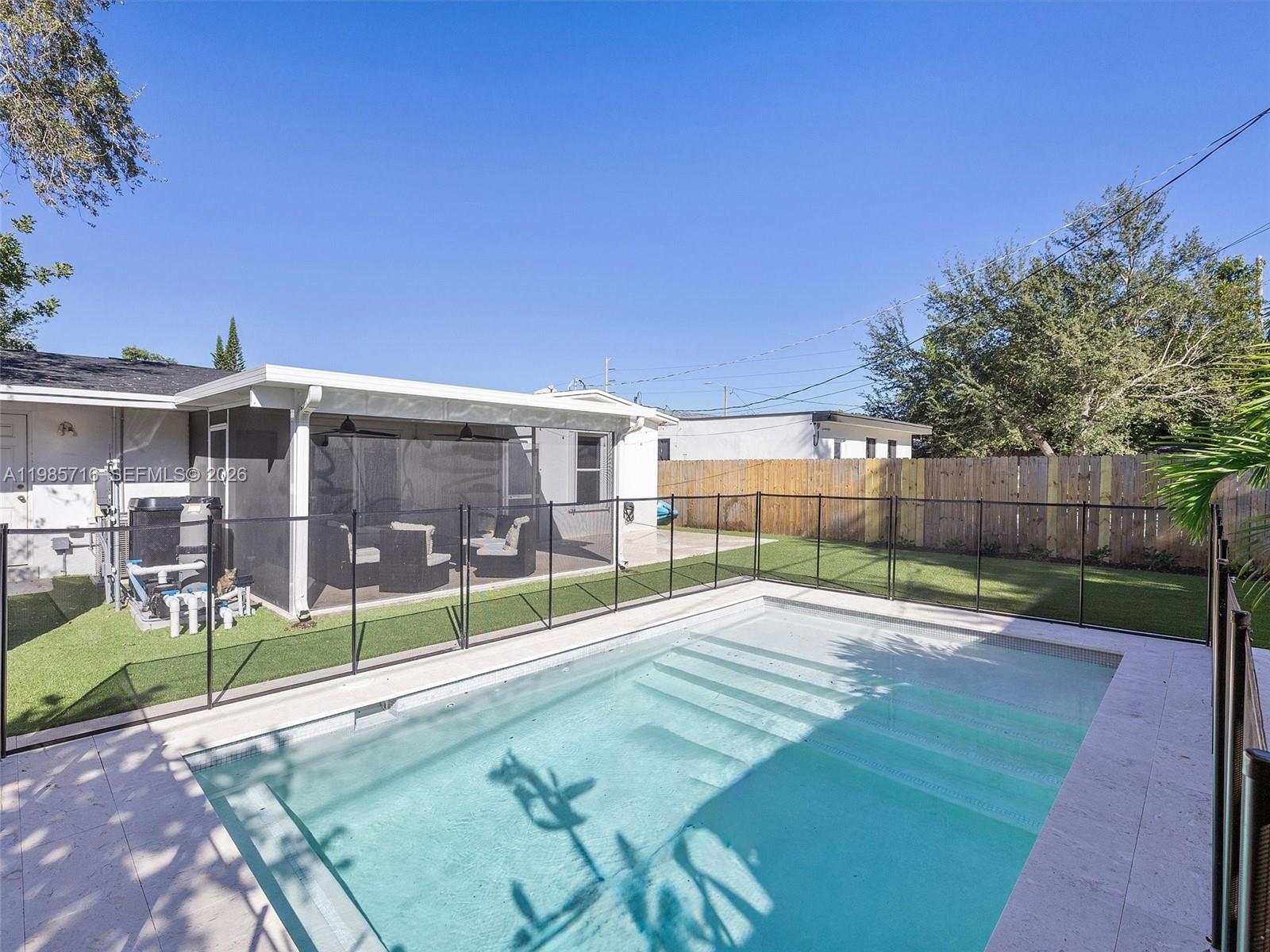 340 Northwest 45th Street Miami, FL 33127 - Photo 6 of 25 a view of a house with a backyard