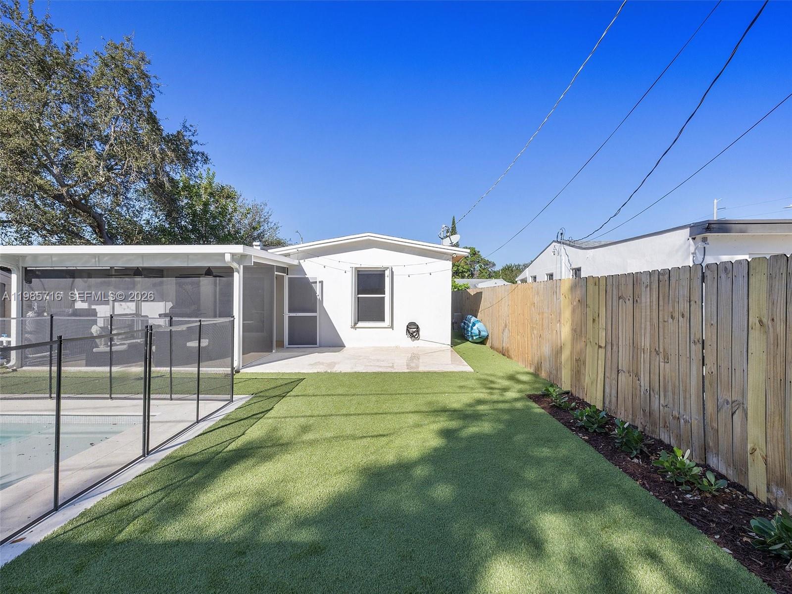 340 Northwest 45th Street Miami, FL 33127 - Photo 7 of 25 a view of a house with backyard and sitting area
