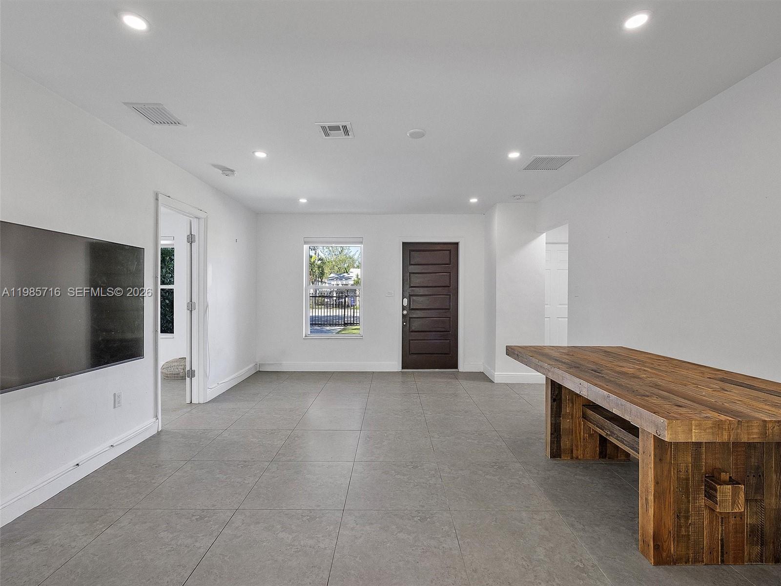 340 Northwest 45th Street Miami, FL 33127 - Photo 10 of 25 a view of room with furniture and natural light