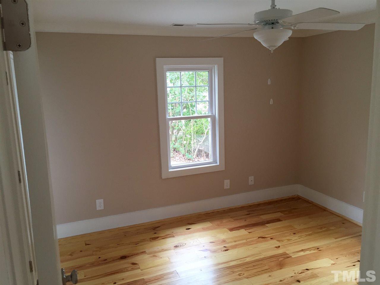 3132 Stanhope Avenue Raleigh, NC 27607 - Photo 8 of 11 a view of empty room with wooden floor and fan