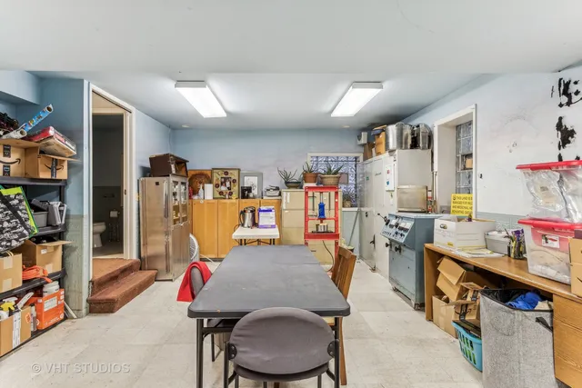a living room with lots of furniture and air hockey table