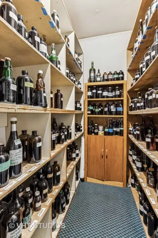 a room with wine cabinets and a wooden floor