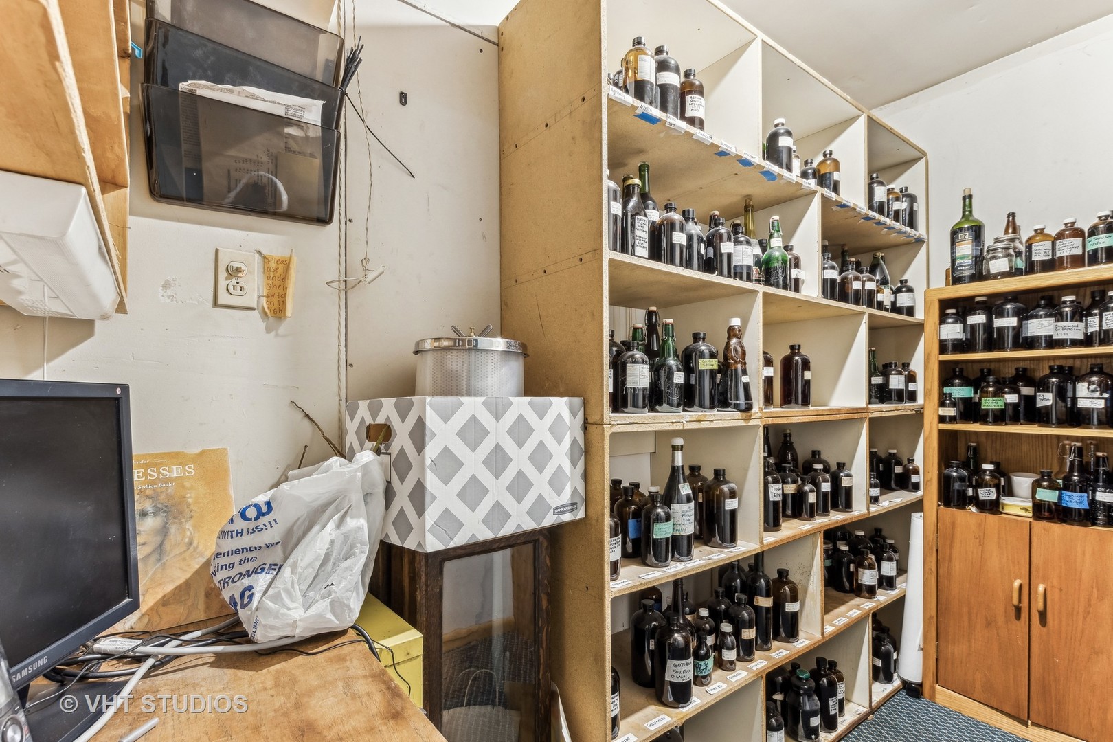 1622 West Devon Avenue Chicago, IL 60626 - Photo 19 of 36 a room with wine cabinets and a wooden floor