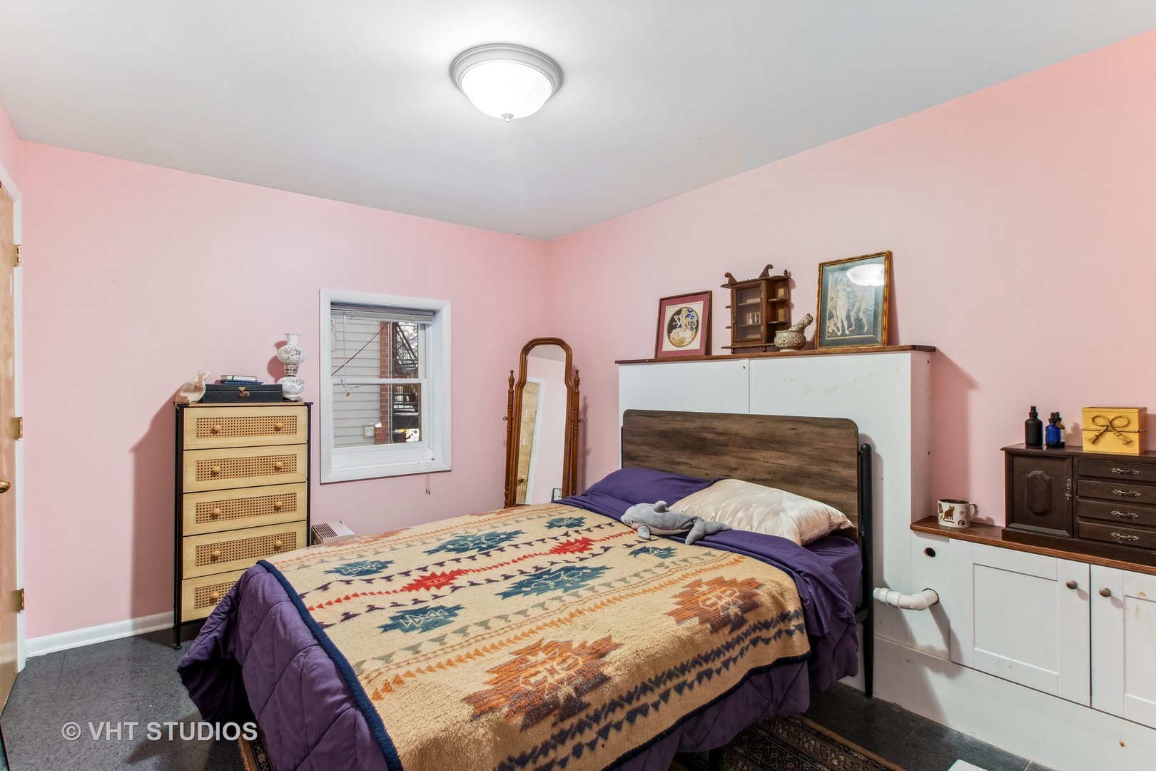 1622 West Devon Avenue Chicago, IL 60626 - Photo 23 of 36 a bedroom with a bed and a dresser
