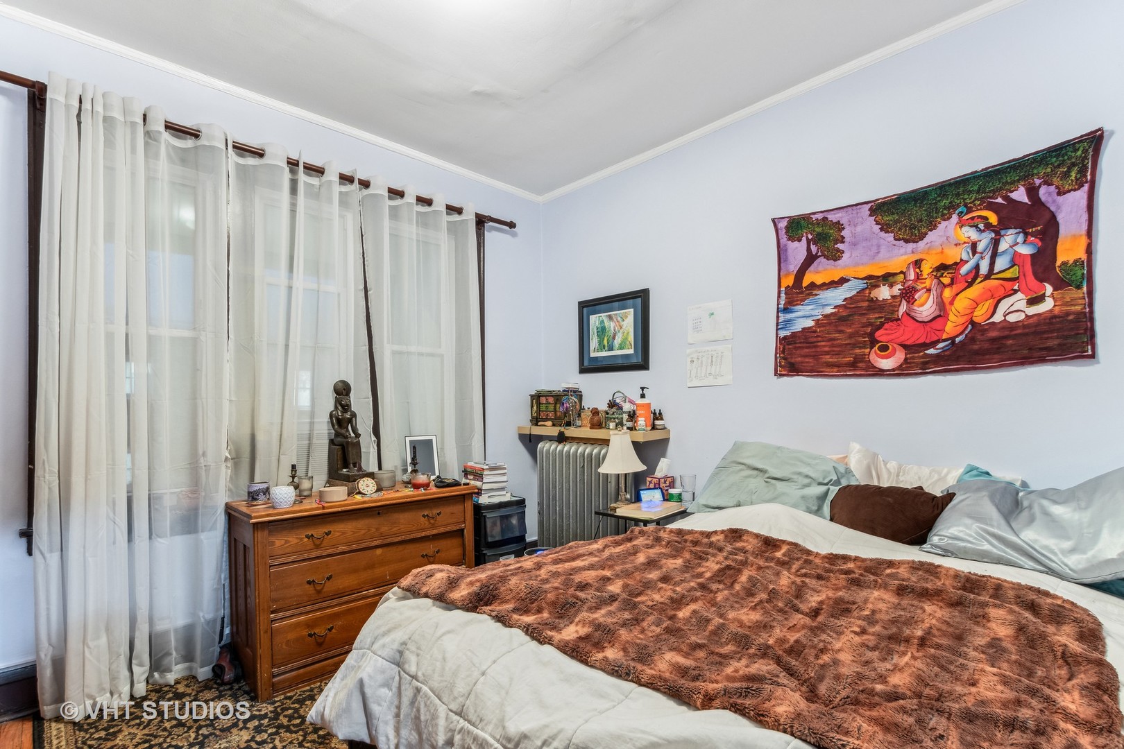 1622 West Devon Avenue Chicago, IL 60626 - Photo 26 of 36 a bed room with a bed and a television