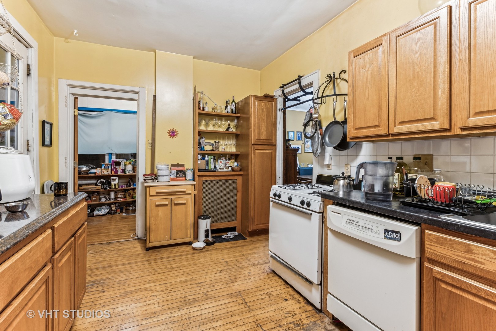 1622 West Devon Avenue Chicago, IL 60626 - Photo 30 of 36 a kitchen with a sink and cabinets