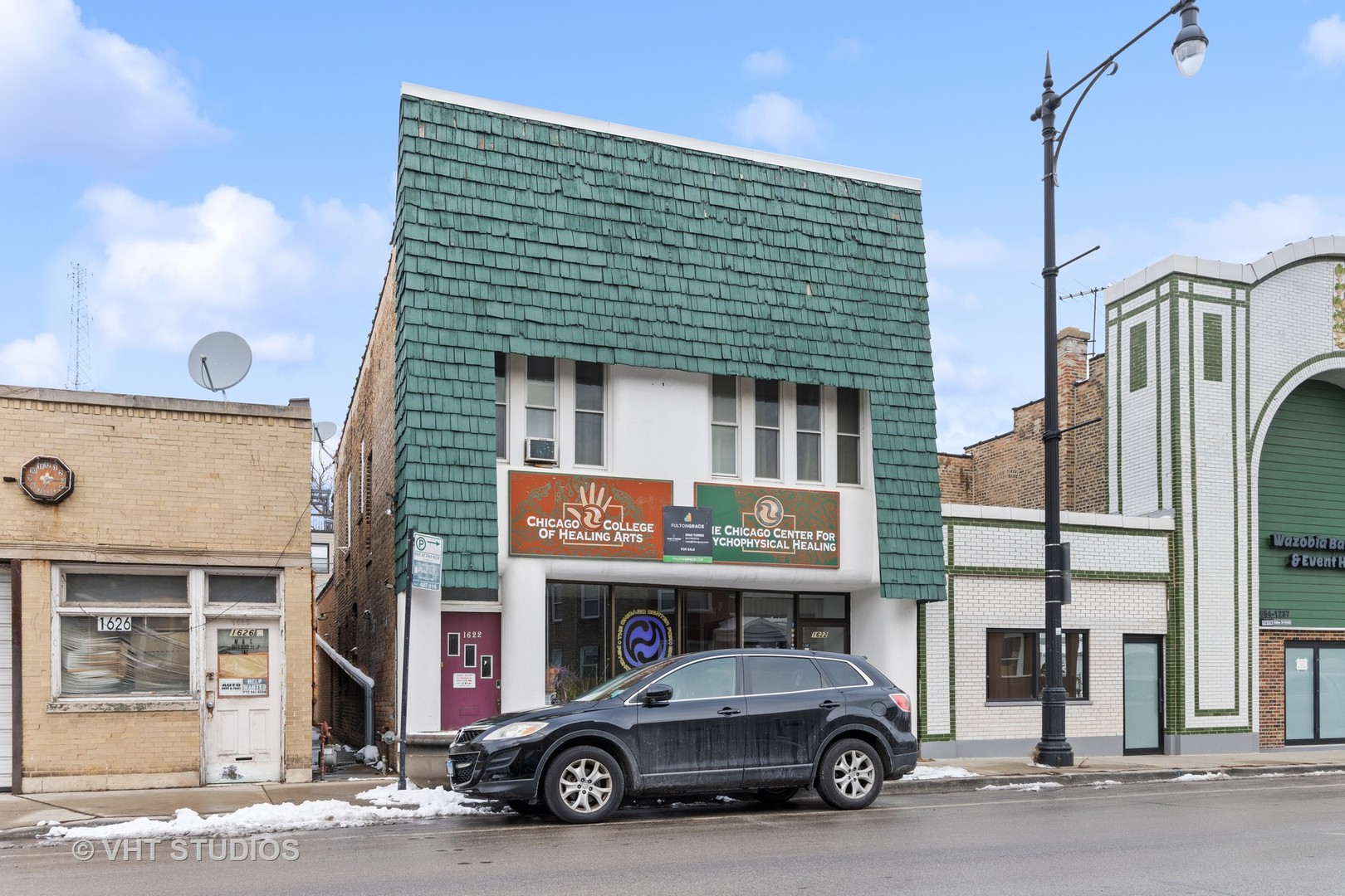 1622 West Devon Avenue Chicago, IL 60626 - Photo 36 of 36 a car parked in front of a building