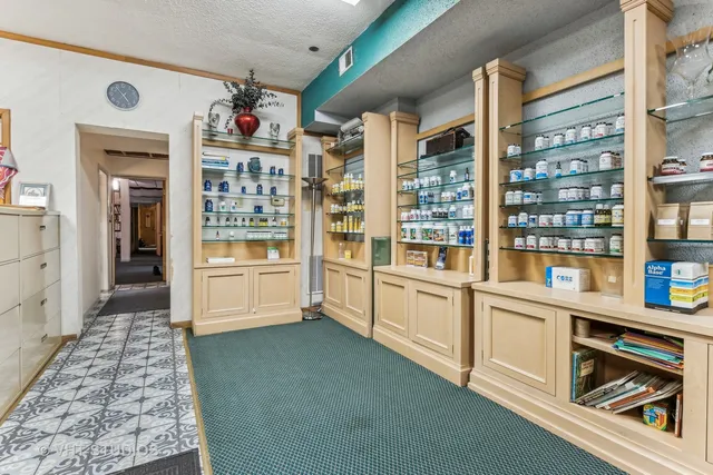 a kitchen with stainless steel appliances cabinets and a large window