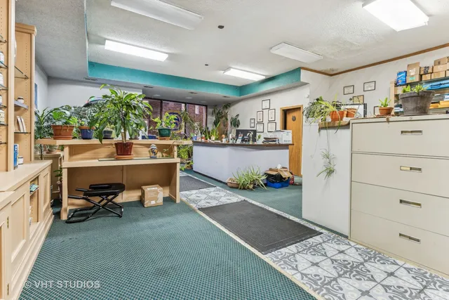 a view of a workspace and kitchen