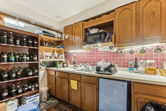 a kitchen with stainless steel appliances a sink and cabinets