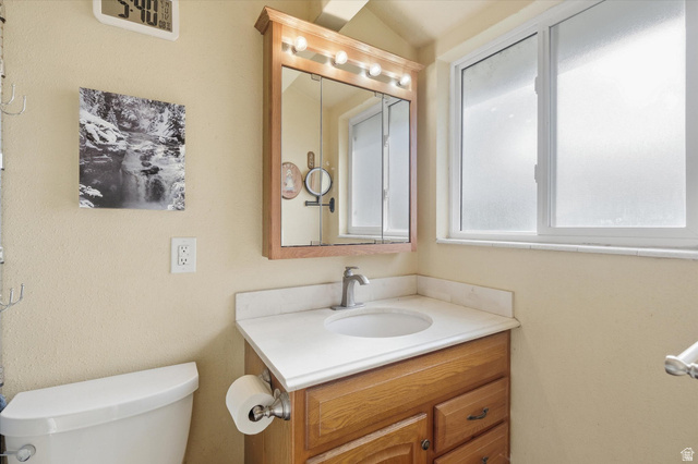 1095 Park Avenue Logan, UT 84321 - Photo 12 of 27 3/4 primary bath featuring toilet and vanity