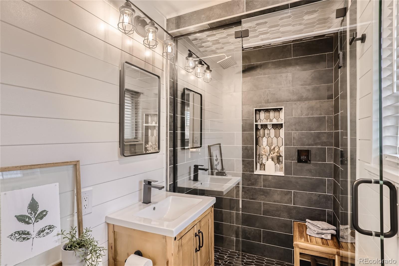 11676 West 37th Place Wheat Ridge, CO 80033 - Photo 15 of 30 a bathroom with a sink shower and a mirror