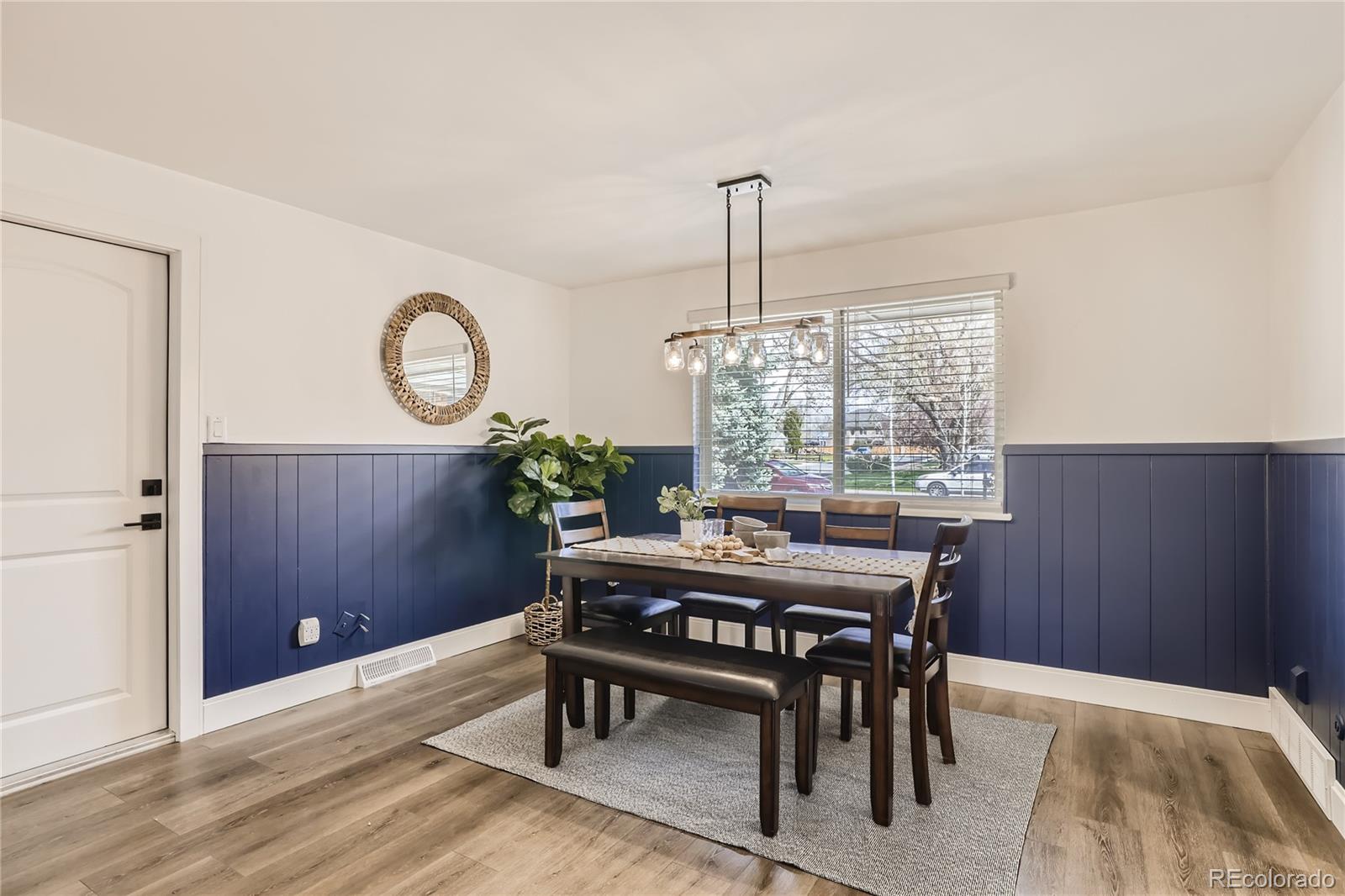 11676 West 37th Place Wheat Ridge, CO 80033 - Photo 19 of 30 a view of a dining room and a table and chairs