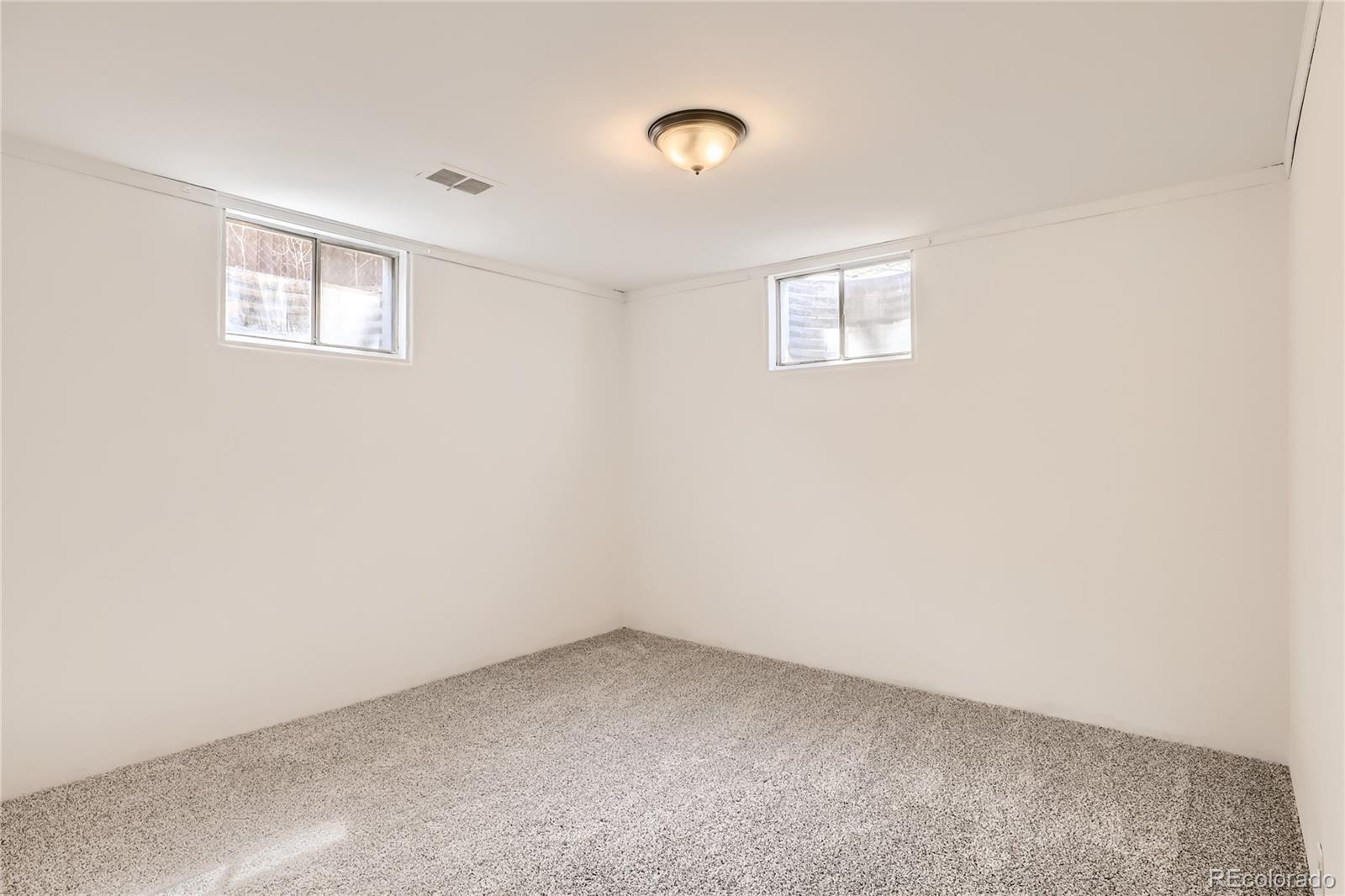 11676 West 37th Place Wheat Ridge, CO 80033 - Photo 21 of 30 an empty room with a window
