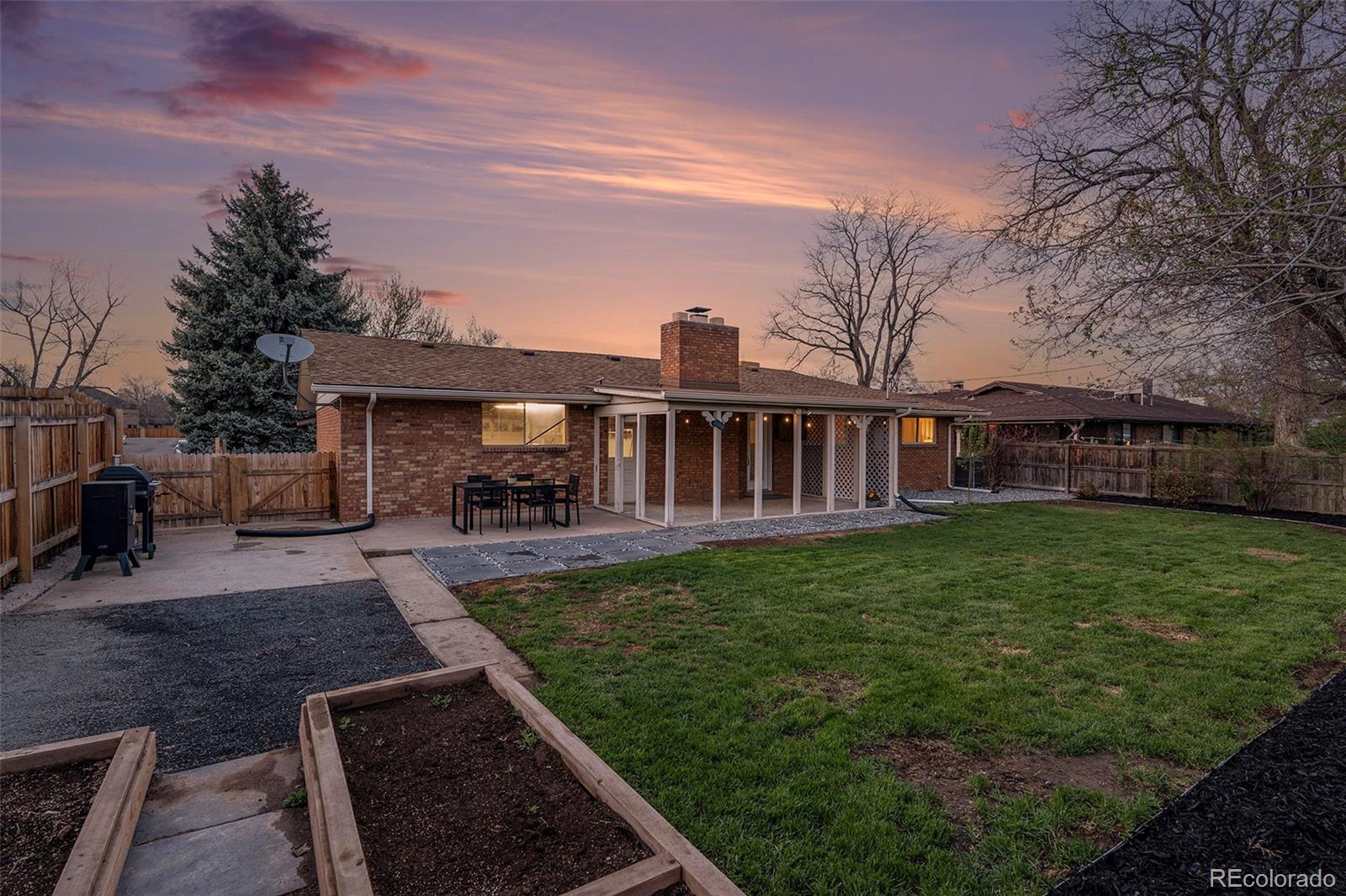 11676 West 37th Place Wheat Ridge, CO 80033 - Photo 25 of 30 a view of a house with backyard porch and sitting area