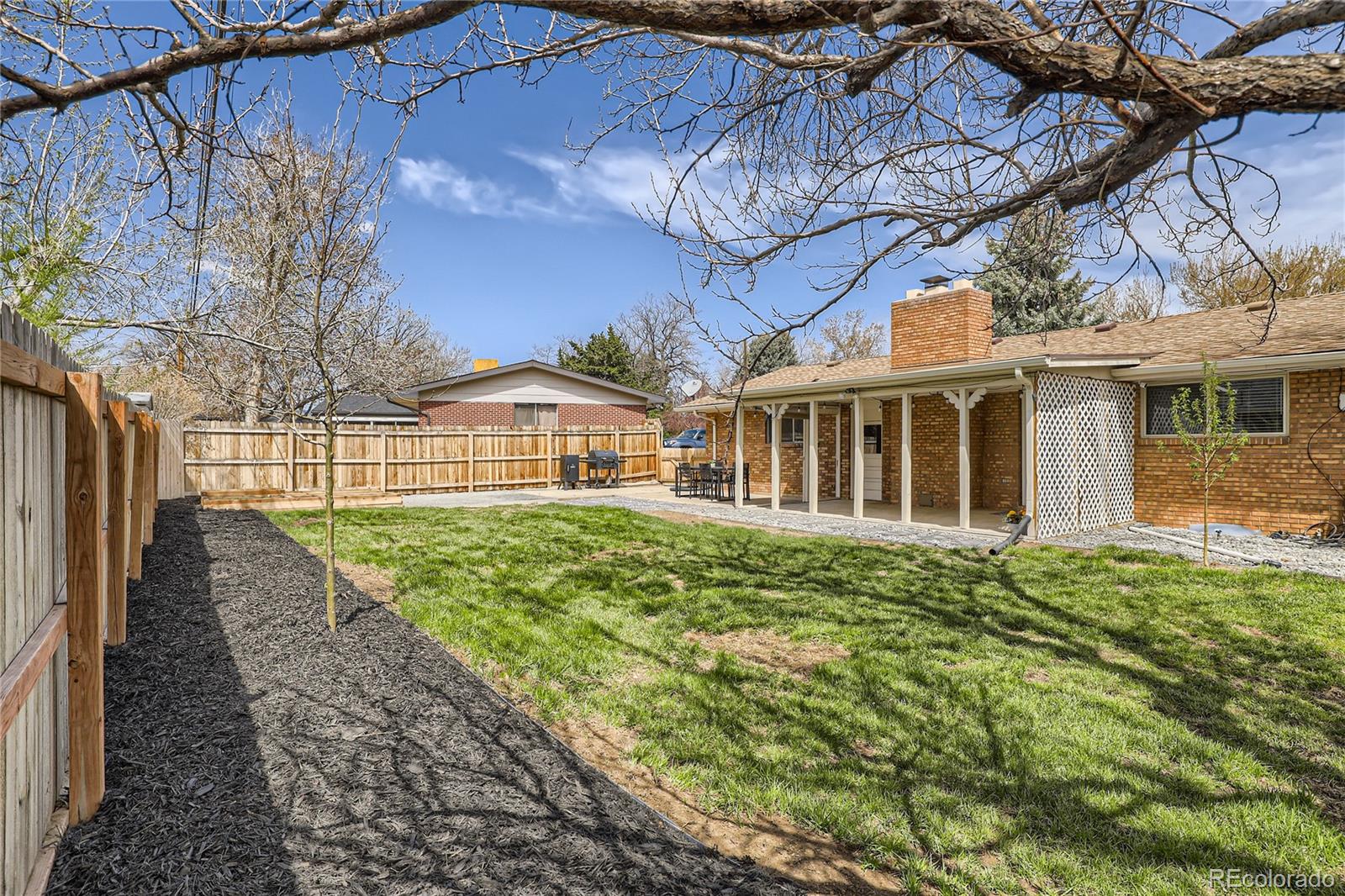 11676 West 37th Place Wheat Ridge, CO 80033 - Photo 29 of 30 a view of a house with a backyard