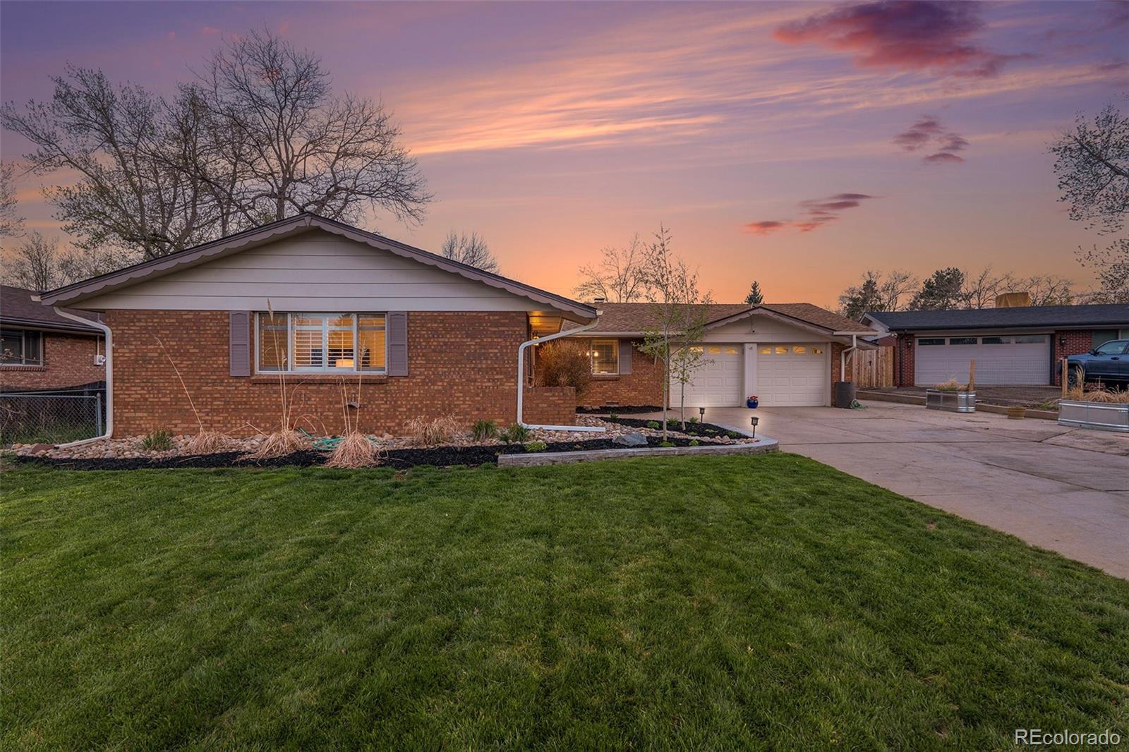 11676 West 37th Place Wheat Ridge, CO 80033 - Photo 3 of 30 a front view of a house with a garden