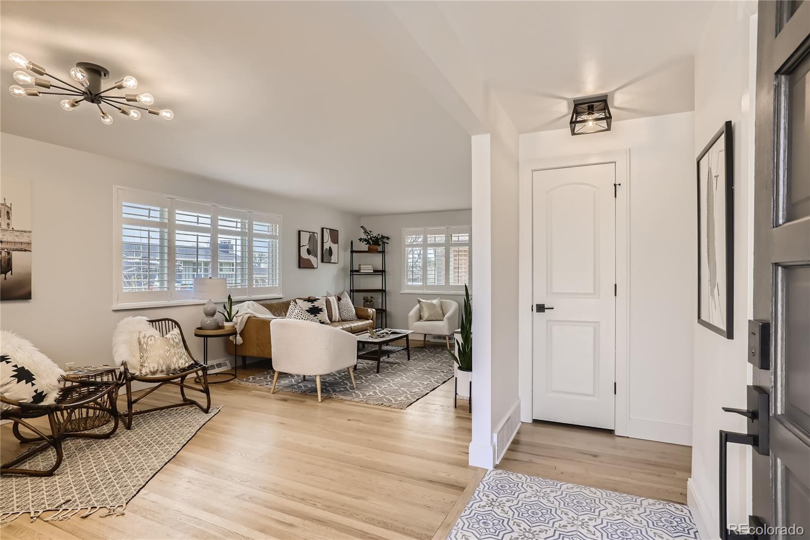 11676 West 37th Place Wheat Ridge, CO 80033 - Photo 4 of 30 a living room with furniture and wooden floor