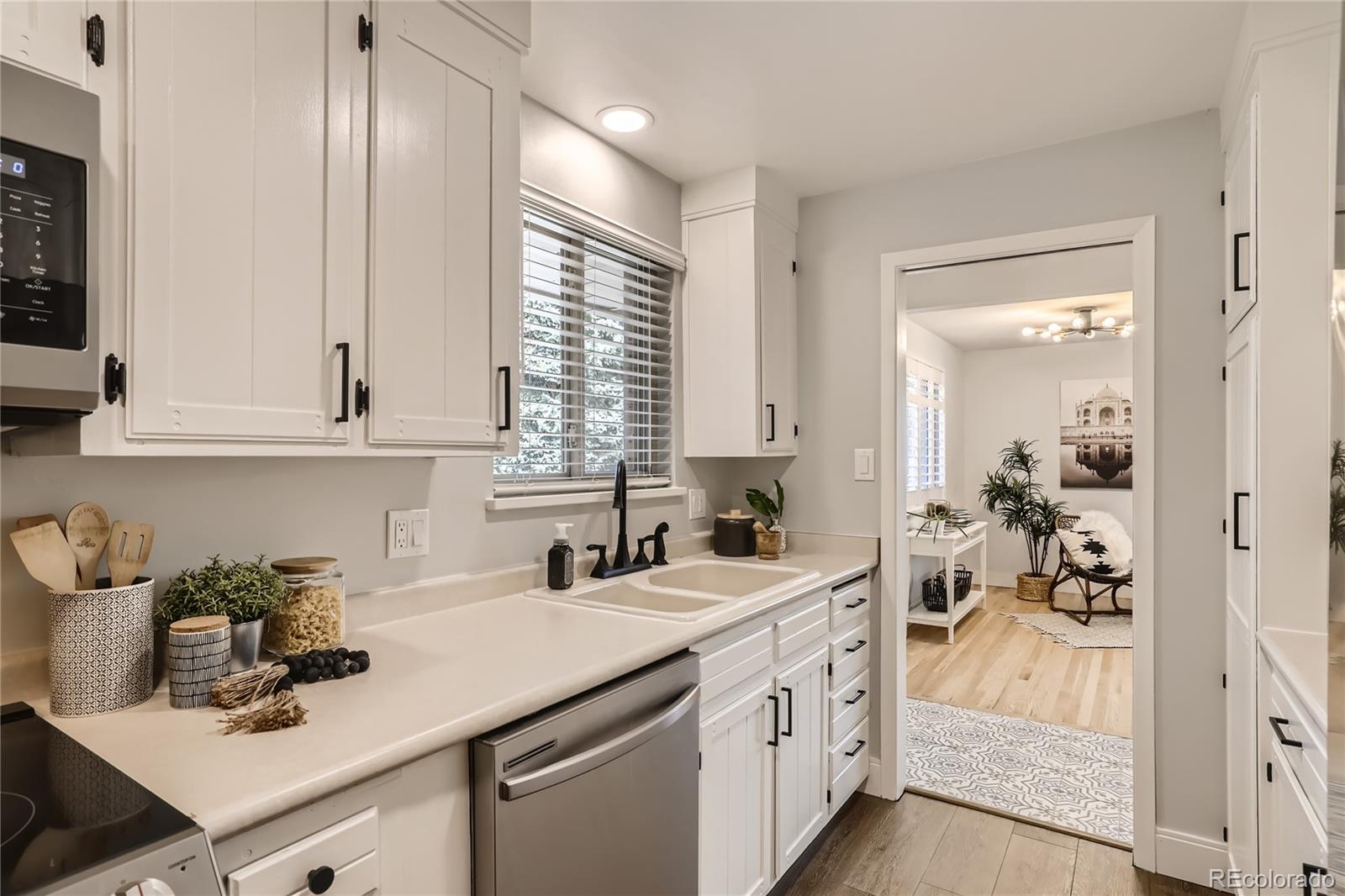 11676 West 37th Place Wheat Ridge, CO 80033 - Photo 8 of 30 a kitchen with sink and cabinets