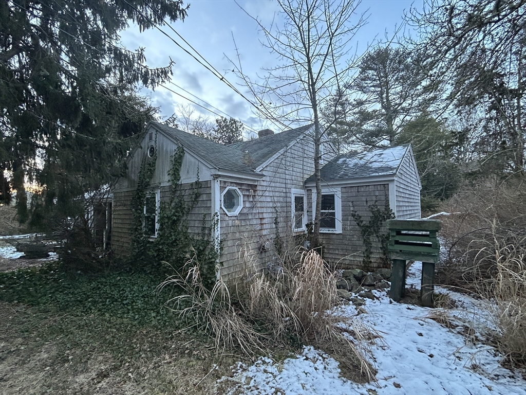 1805 Main Street Chatham, MA 02633 - Photo 5 of 6 a front view of a house with garden