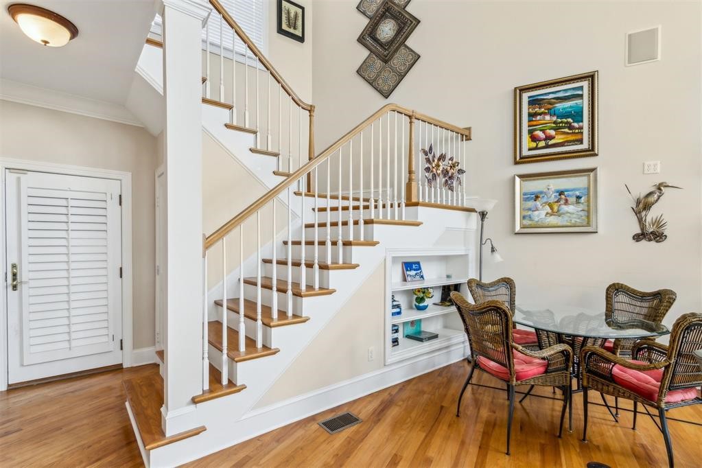 3119 Sea Marsh Road Fernandina Beach, FL 32034 - Photo 20 of 41 a view of a dining room with furniture wooden floor and a rug