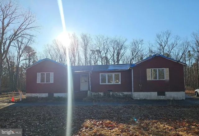a house view with a backyard space