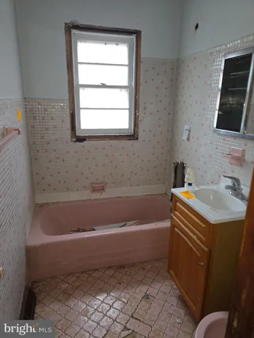 a kitchen with a refrigerator and cabinets