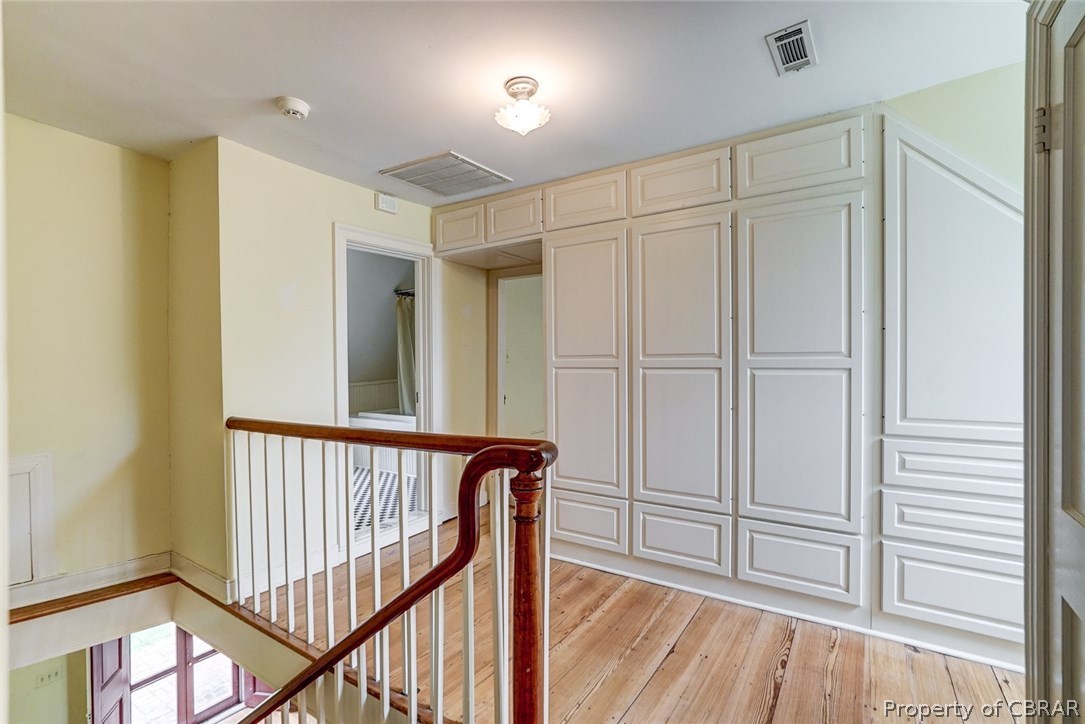 1679 Ottoman Ferry Road Lancaster, VA 22503 - Photo 39 of 50 Upstairs hallway of main dwelling with well-planned built-ins.