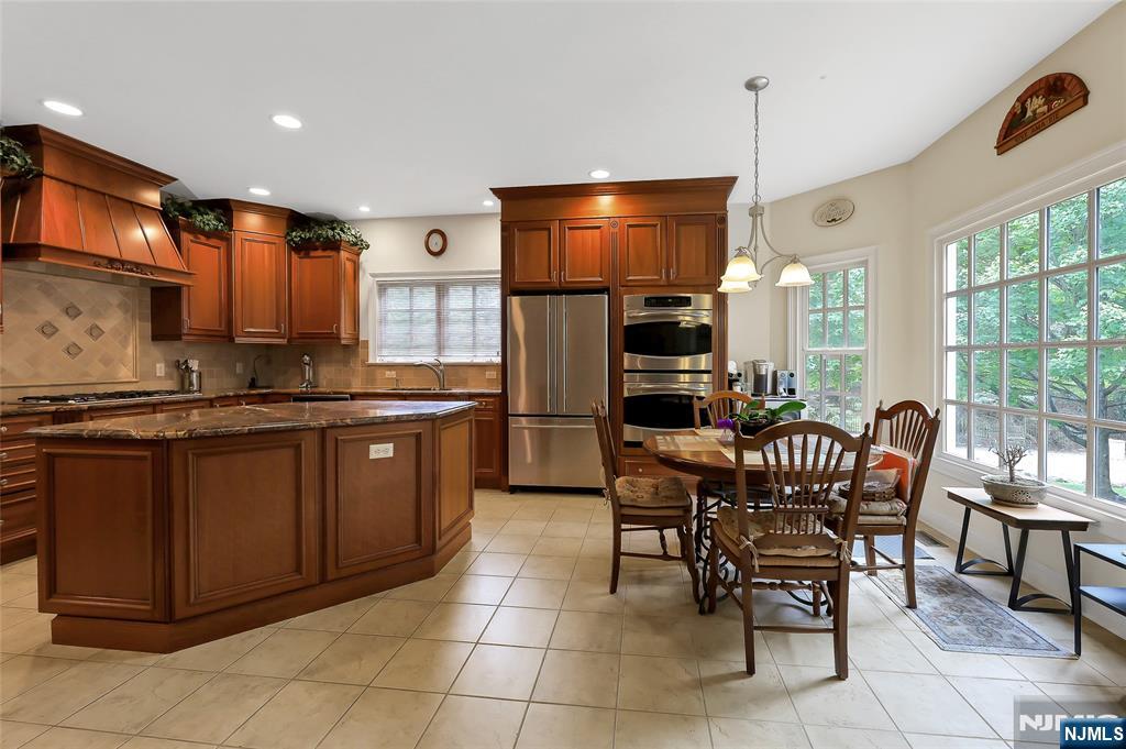 22 Meadowlake Drive Mahwah, NJ 07430 - Photo 12 of 39 a kitchen with a sink cabinets and stainless steel appliances